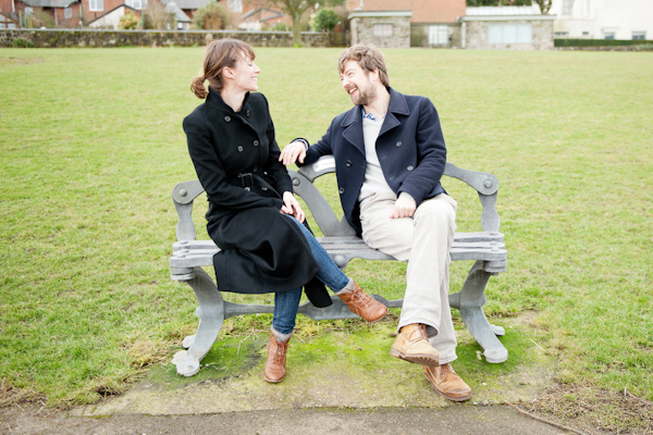 Laughing on a park bench